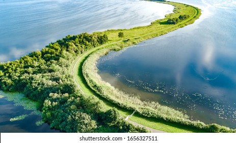 Aerial Drone View Of Path On Dam In Polder Water From Above, Landscape And Nature Of North Holland, Netherlands
