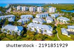 Aerial Drone View of Real Estate in Bonita Springs, Florida with the Bay and Mangroves in the Background