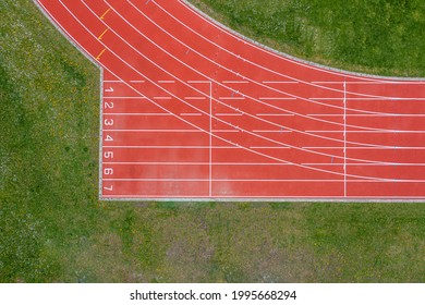 Aerial Drone View Of A Red Running Track.