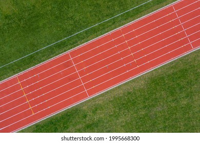 Aerial Drone View Of A Red Running Track.