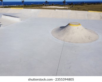 Aerial drone view of a skatepark near the sea - Powered by Shutterstock