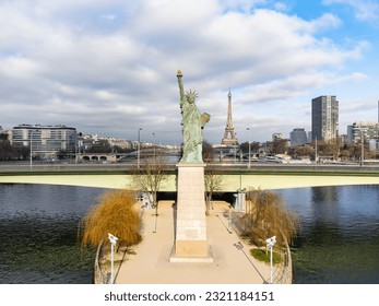 Aerial drone view of the the Statue of Liberty of Paris, France, with The Eiffel Tower in the background