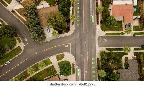 Aerial Drone View Of A Suburban Neighborhood Street And Intersection