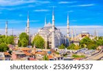 Aerial drone view of Sultanahmet or Blue mosque and Hagia Sophia in Sultanahmet district in Istanbul, Turkey against blue sky