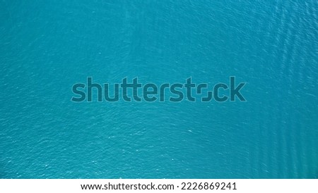 Aerial drone view of surface of sea . Blue color water background