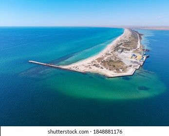 Aerial Drone View Of A Tropical Sandy Beach Dividing An Exotic Turquoise Sea And Lake. Sand Bar In The Sea From Above, Flight Over Sand Bar And Colorful Sea