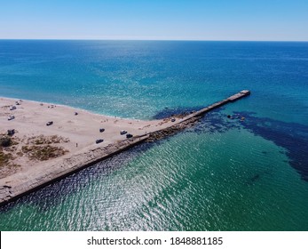 Aerial Drone View Of A Tropical Sandy Beach Dividing An Exotic Turquoise Sea And Lake. Sand Bar In The Sea From Above, Flight Over Sand Bar And Colorful Sea