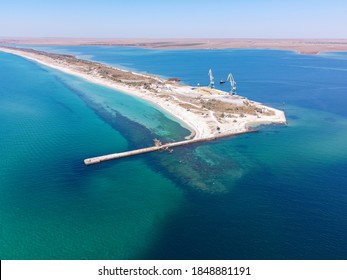 Aerial Drone View Of A Tropical Sandy Beach Dividing An Exotic Turquoise Sea And Lake. Sand Bar In The Sea From Above, Flight Over Sand Bar And Colorful Sea