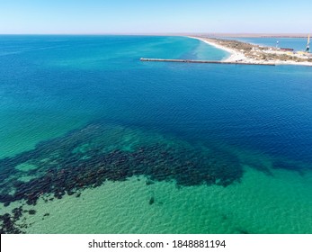 Aerial Drone View Of A Tropical Sandy Beach Dividing An Exotic Turquoise Sea And Lake. Sand Bar In The Sea From Above, Flight Over Sand Bar And Colorful Sea