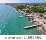 Aerial drone view of West Bay Beach in Grand Cayman in the Cayman Islands. Beautiful blue ocean scenery. This beach is the last section of famous and popular Seven Mile Beach.