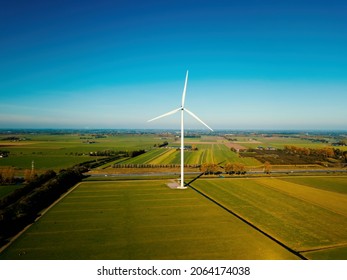 Aerial Drone View Of The Wind Turbine At The Flat Landscape In The Netherlands.