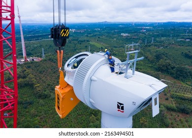 Aerial Drone View Of Wind Turbine Engine Under Construction To Create Alternative Power. Green Energy Concept To Reduce Global Warming Climate Change And Pollution.