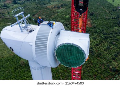 Aerial Drone View Of Wind Turbine Engine Under Construction To Create Alternative Power. Green Energy Concept To Reduce Global Warming Climate Change And Pollution.