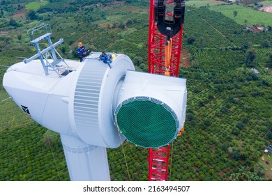 Aerial Drone View Of Wind Turbine Engine Under Construction To Create Alternative Power. Green Energy Concept To Reduce Global Warming Climate Change And Pollution.