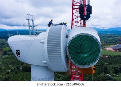 Aerial Drone View Of Wind Turbine Engine Under Construction To Create Alternative Power. Green Energy Concept To Reduce Global Warming Climate Change And Pollution.