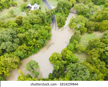 Aerial Drone Views Above Brushy Creek Flooding And Taking Off The Roadway , Road Closures And Don't Drown Turn Around Slogans And Signs Mark The Dangerous Flooded Roads In Austin , Texas , USA