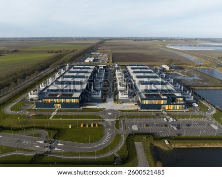 Aerial drone views of a supercomputer data center, artificial intelligence, and internet infrastructure in the Netherlands. Big data, quantum computing, supercomputer.