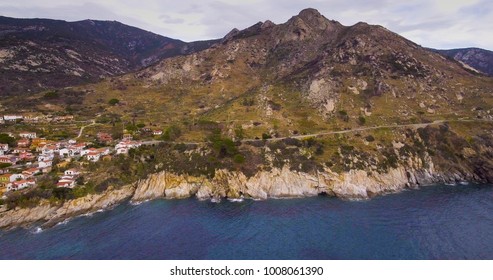 Aerial, Elba island coast with a little town near the sea