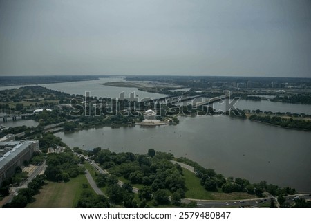 aerial elevated view of the Thomas Jefferson Memorial with the Potomac River and Ronald Reagan Washington National Airport in the background