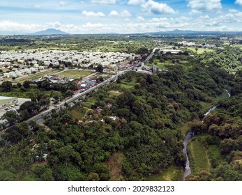 Aerial Of Emilio Aguinaldo Highway And A Nearby River In Dasmarinas Cavite. View Of Road That Goes Straight To Tagaytay