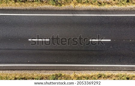 Aerial. Empty countryside highway asphalt road. Top view.