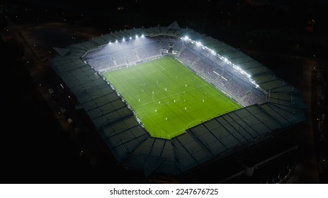 Aerial Establishing Shot of a Whole Stadium with Soccer Championship Match. Teams Play, Crowd of Fans Cheer. Football Tournament, Cup Broadcast. Sports Channel Television, Screen Content Concept. - Shutterstock ID 2247676725