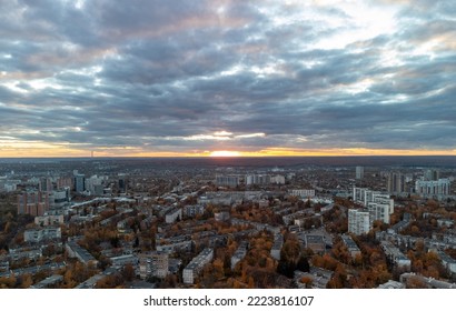Aerial evening view Kharkiv city Pavlove Pole district. Multistory buildings residential in autumn sunset light