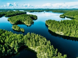 Aerial Finland Landscape. Aerial View Of Blue Lakes With Rock Islands And Green Woods In Summer