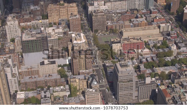 AERIAL: Flying high above the rooftops of residential
buildings, apartments, condos and flats in beautiful historically
important neighborhood of East Village in NYC borough of Manhattan
on sunny day