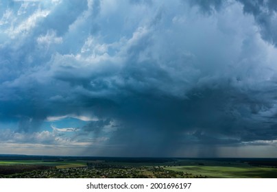 Aerial Flying Over Countryside With Village, Forest, Ponds, And Fields At Summer Time Under Dramatic Rain Cloud. Global Warming Effect Black Thunderstorm Dramatic Rain Clouds, Dramatic Sky.	