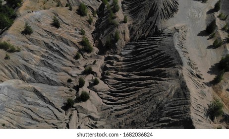 Aerial footage of gray mountains and ravine. Great top view on a canyon with gray mountains. Another planet footage