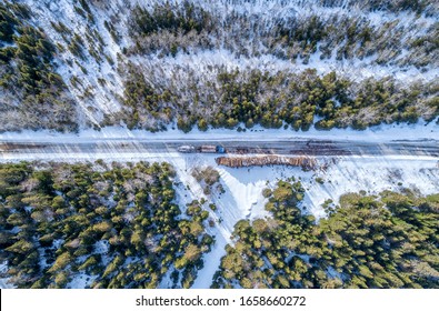 Aerial Forestry Truck Loading Fresh Cut Timber - Northern Ontario Canada