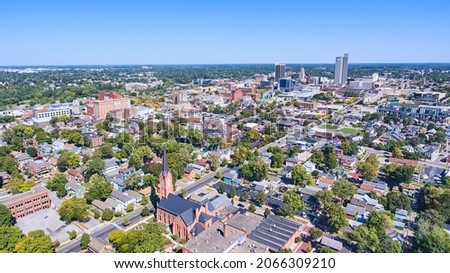 Aerial of Fort Wayne, Indiana with church in front and downtown in background