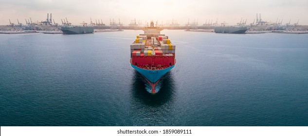 Aerial in front of cargo ship carrying container and running 
near international custom depot sea port concept smart logistic service.