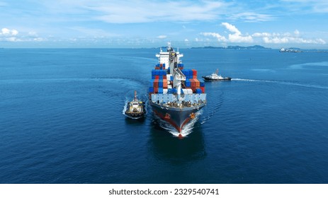 Aerial front view of cargo ship carrying container and running with tug boat for import export goods from cargo yard port to custom ocean concept freight shipping by ship . - Shutterstock ID 2329540741