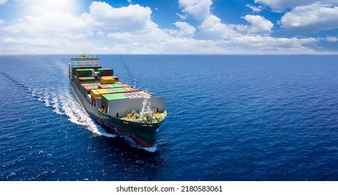Aerial front view of a container cargo vessel traveling over the ocean with copy space as a banner - Shutterstock ID 2180583061