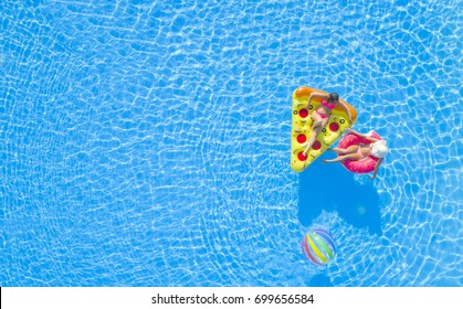 AERIAL Girlfriends Enjoying On Fun Inflatable Pizza And Doughnut Floats In Pool