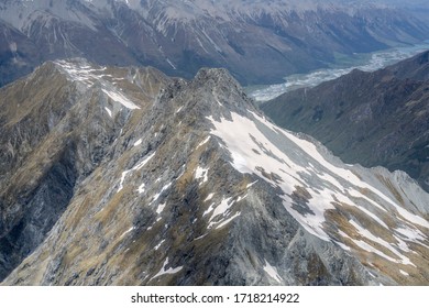 aerial, from a glider, of Tent peak summit and Hunter river valley in background, shot in bright spring light from above, Otago, South Island, New Zealand - Shutterstock ID 1718214922