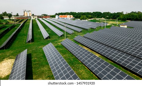 Aerial green rural and solar photovoltaic panel - Shutterstock ID 1457931920