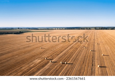 Aerial Harvest: Scenic Overlook of Field with Haystacks