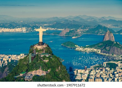 Aerial helicopter panorama of Botafogo Bay with Christ and Sugar Loaf Mountain in Rio de Janeiro, Brazil - Shutterstock ID 1907911672