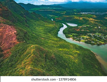 An aerial helicopter view of Huleia Stream and Menehune Fish Pond, just north of Nawiliwili Harbor in Lihue on the southeastern side of the island of Kauai, Hawaii, United States.