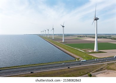 Aerial from the highway A7 and windmills in the countryside from the Netherlands