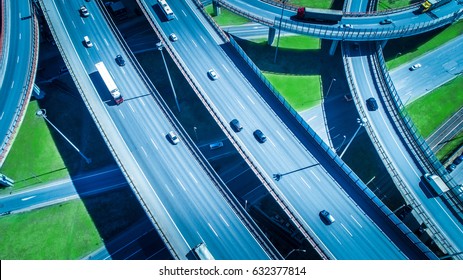 Aerial Highway Junction. Busy Highway From Aerial View. Highway Shape Like Number 8 And Infinity Sign. Urban Highway And Lifestyle Concept.