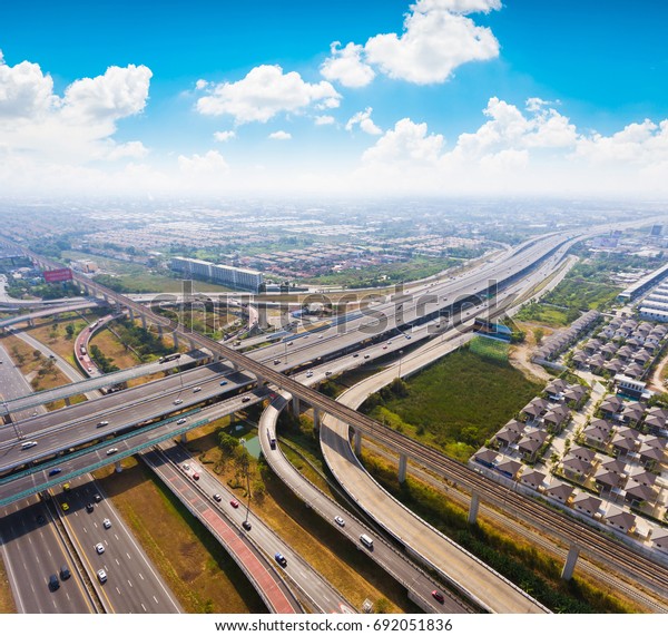 Aerial
highway junction. Busy highway from aerial view.  Urban highway and
lifestyle concept. Highway  Bangkok
Thailand.