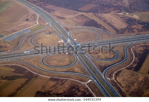 Aerial highway junction. Highway shape like number\
8 and infinity sign.
