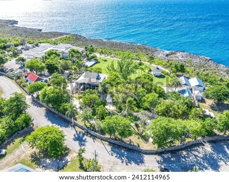 Aerial of historic Pedro St James Bodden Town Savannah Prospect Grand Cayman Cayman Islands with lush greenery trees and buildings beautiful pristine sea ocean turquoise blue water 