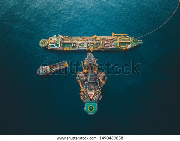 Aerial image
of drilling rig doing a drilling at wellhead with Floating
Production Storage Offloading at the
side.