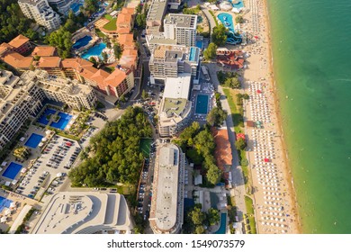 Aerial image a drone resort Golden Sands on Black Sea coast in Bulgaria. Many hotels and beaches with tourists, sunbeds and umbrellas. Sea travel destination. Travel and vacation concept - Shutterstock ID 1549073579