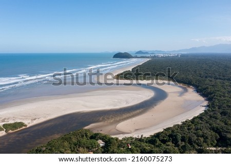 
Aerial image of the meeting between the water of the River and the Sea. Environmental reserve, beautiful and empty beach